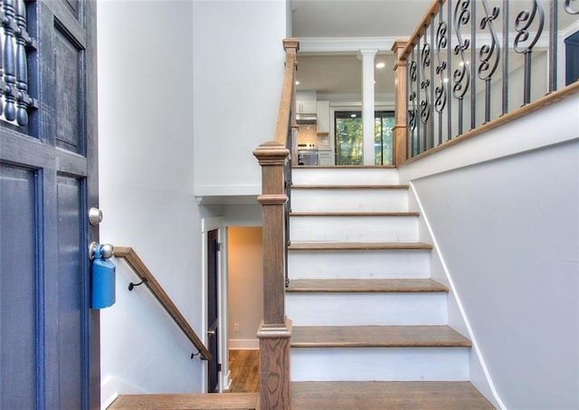 stairway featuring hardwood / wood-style floors