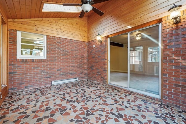 unfurnished sunroom featuring ceiling fan, lofted ceiling with skylight, and a baseboard radiator