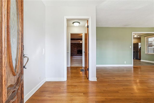 unfurnished room with light hardwood / wood-style floors