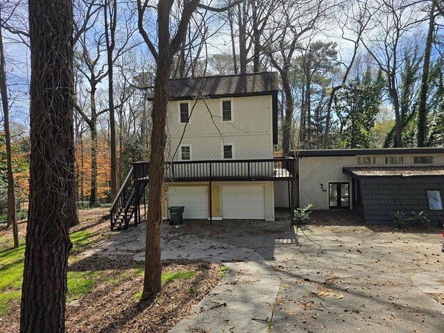 1920 Moores Mill Rd NW, Atlanta, GA 30318 - exterior space featuring stairs, a garage, french doors, and concrete driveway