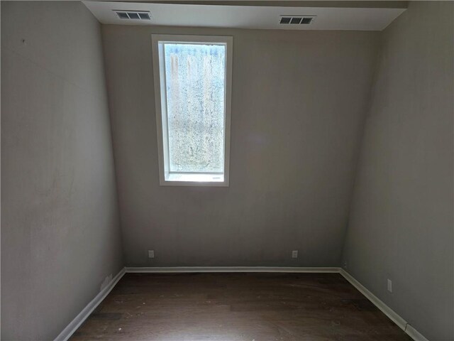 1920 Moores Mill Rd NW, Atlanta, GA 30318 - unfurnished room with baseboards, visible vents, and dark wood-type flooring