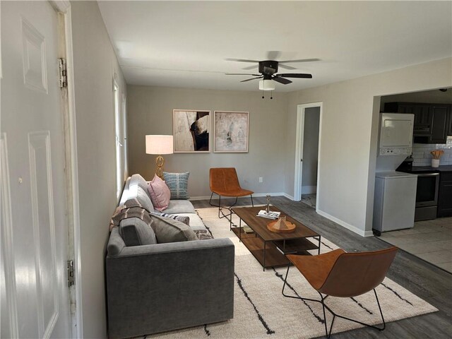 1920 Moores Mill Rd NW, Atlanta, GA 30318 - living room featuring a ceiling fan, baseboards, and wood finished floors