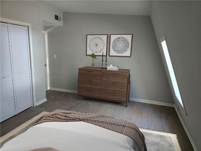 1920 Moores Mill Rd NW, Atlanta, GA 30318 - bedroom with a closet, baseboards, light wood finished floors, and visible vents
