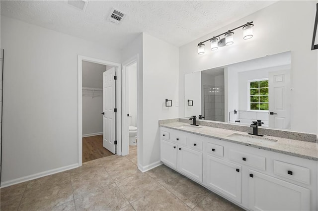 3405 Summer Brooke Way, Union City, GA 30291 - full bath with double vanity, a spacious closet, tile patterned floors, a tile shower, and a textured ceiling