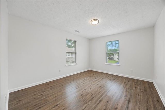 3405 Summer Brooke Way, Union City, GA 30291 - spare room with healthy amount of natural light, wood finished floors, and a textured ceiling
