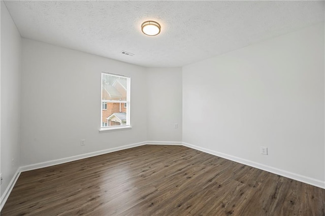 3405 Summer Brooke Way, Union City, GA 30291 - empty room with dark wood finished floors and a textured ceiling