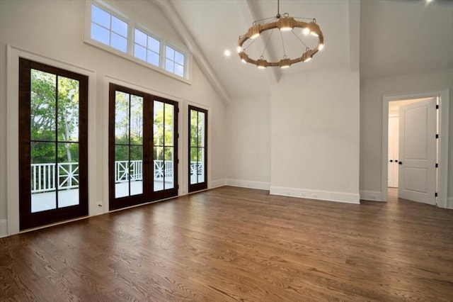 foyer featuring high vaulted ceiling, a chandelier, dark wood-style floors, baseboards, and beam ceiling