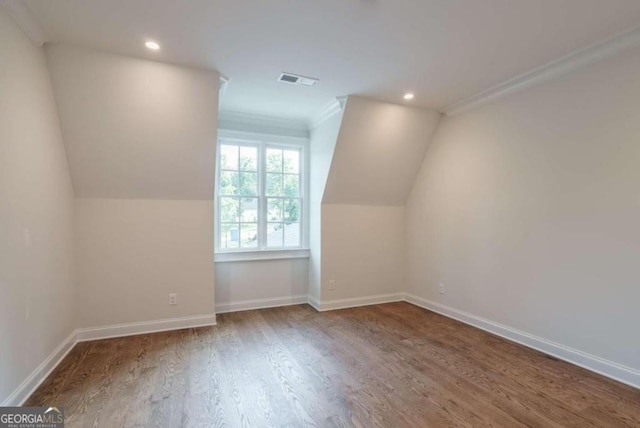 bonus room with wood finished floors, recessed lighting, baseboards, and vaulted ceiling