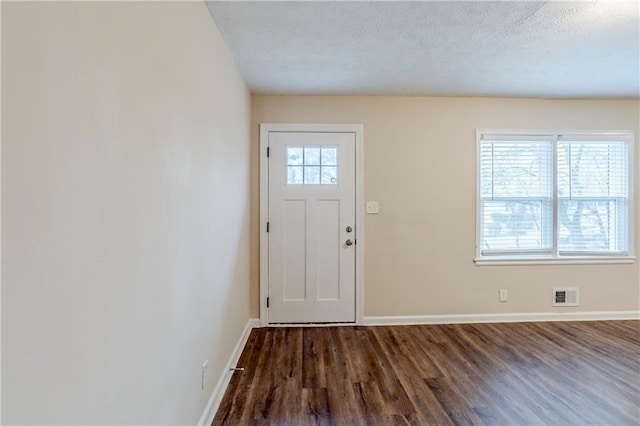 2504 Brentwood Rd, Decatur, GA 30032 - entrance foyer with baseboards, visible vents, wood finished floors, and plenty of natural light