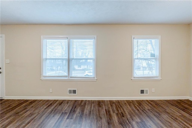 2504 Brentwood Rd, Decatur, GA 30032 - empty room with wood finished floors, baseboards, and visible vents