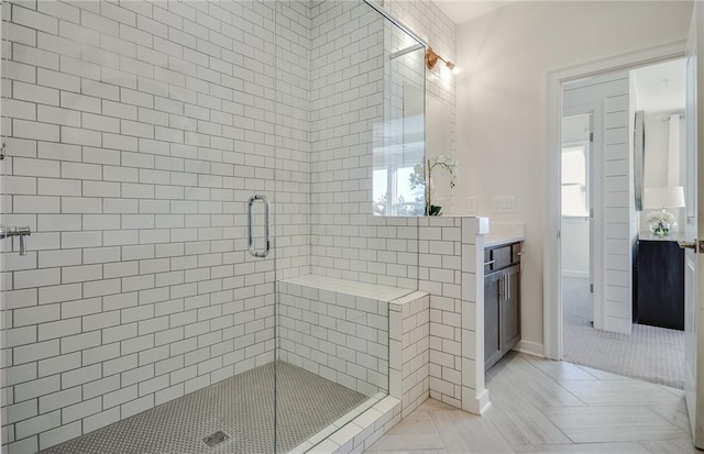 bathroom with tile patterned flooring, an enclosed shower, and vanity