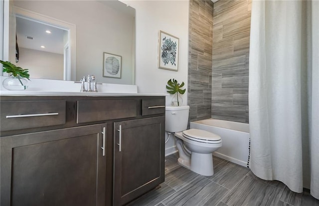 full bathroom featuring toilet, shower / bathtub combination with curtain, and vanity