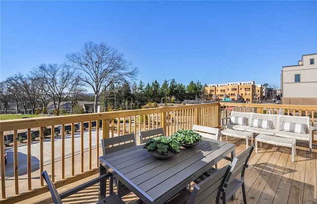 wooden terrace featuring an outdoor hangout area