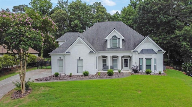 2330 Wood Creek Ct, Dacula, GA 30019 - view of front facade with a front yard, roof with shingles, and a porch