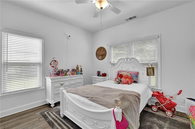 2330 Wood Creek Ct, Dacula, GA 30019 - bedroom featuring wood finished floors, multiple windows, and ceiling fan