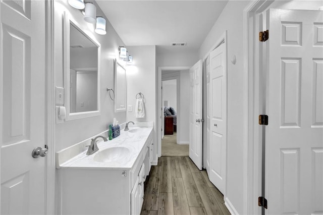 2330 Wood Creek Ct, Dacula, GA 30019 - bathroom featuring double vanity and wood finished floors