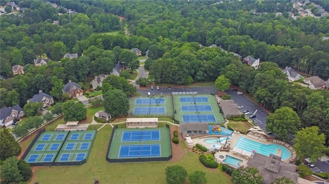 2330 Wood Creek Ct, Dacula, GA 30019 - aerial view of property and surrounding area with a pool and a heavily wooded area