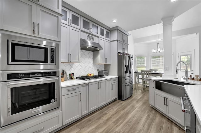 2330 Wood Creek Ct, Dacula, GA 30019 - kitchen featuring stainless steel appliances, gray cabinetry, recessed lighting, a chandelier, and light countertops