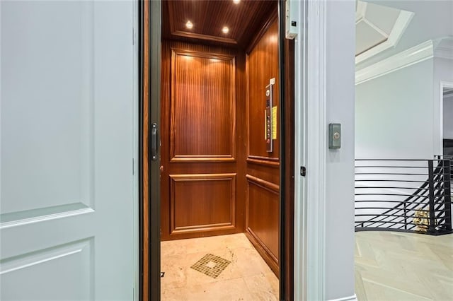 room details featuring crown molding, recessed lighting, and elevator