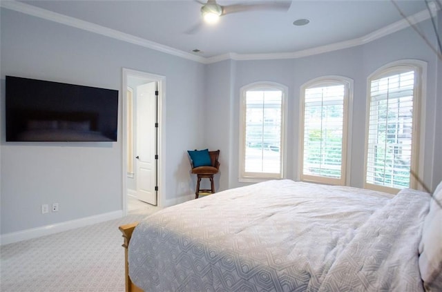 bedroom featuring carpet, multiple windows, and crown molding