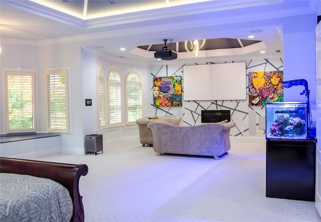 rec room with ornamental molding, carpet, a raised ceiling, and a fireplace