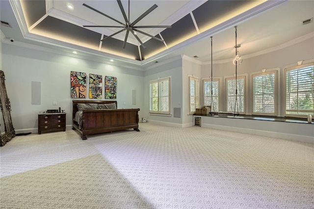 bedroom featuring baseboards, ornamental molding, a raised ceiling, and light colored carpet