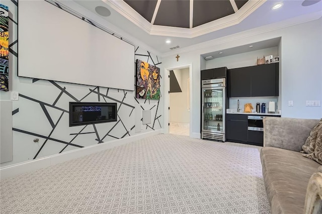 interior space with wine cooler, recessed lighting, visible vents, ornamental molding, and baseboards