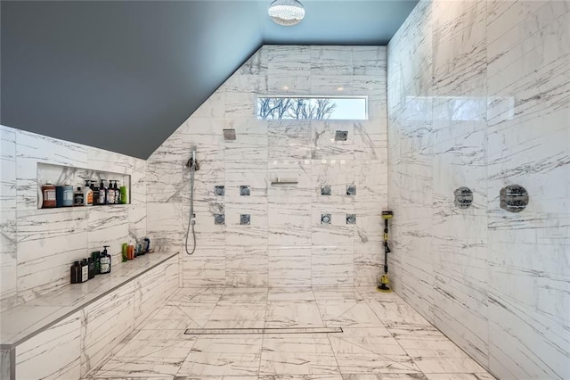 bathroom with a tile shower