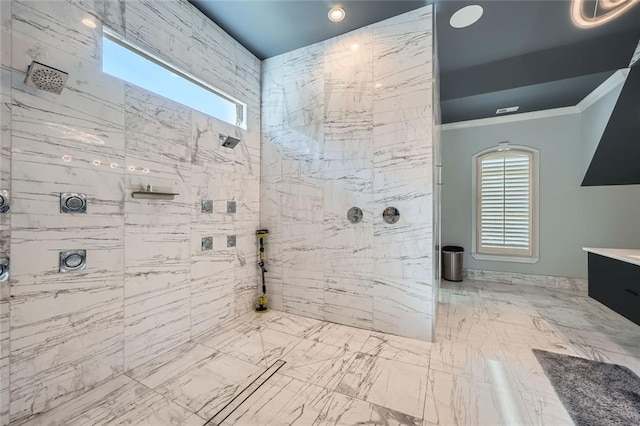 full bathroom with a healthy amount of sunlight, ornamental molding, a walk in shower, and vanity