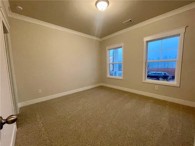 carpeted empty room with ornamental molding