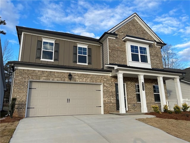 craftsman-style house featuring covered porch and a garage