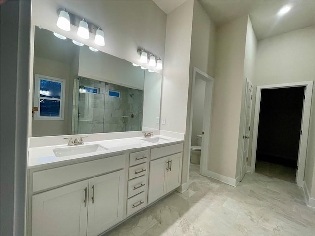 bathroom with walk in shower, vanity, and toilet