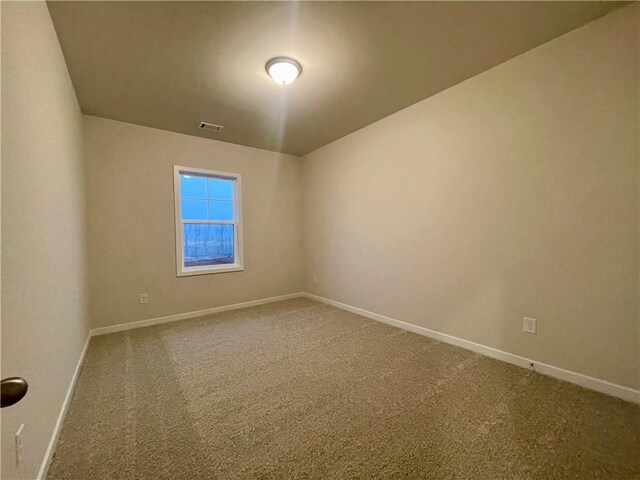 unfurnished room with carpet flooring