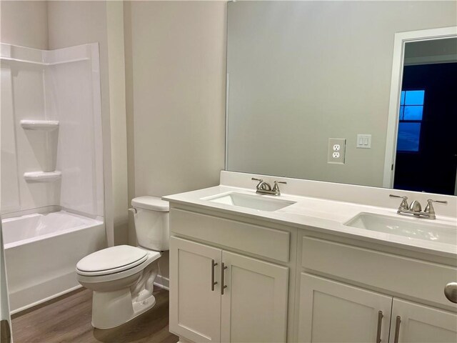 clothes washing area featuring hookup for a washing machine, dark hardwood / wood-style floors, and hookup for an electric dryer