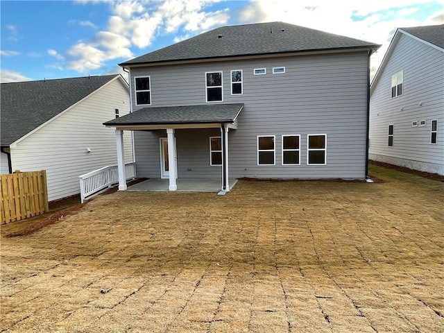 back of house with a patio