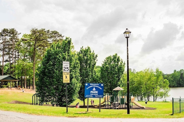 surrounding community with a yard and a playground