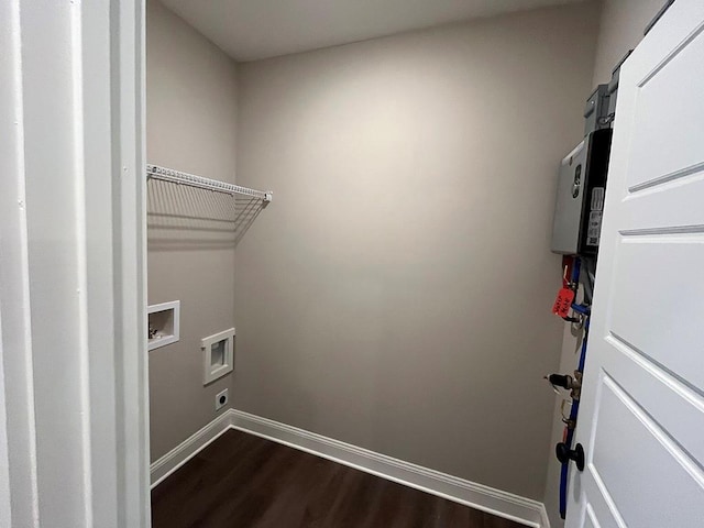 washroom featuring dark hardwood / wood-style floors and hookup for a washing machine