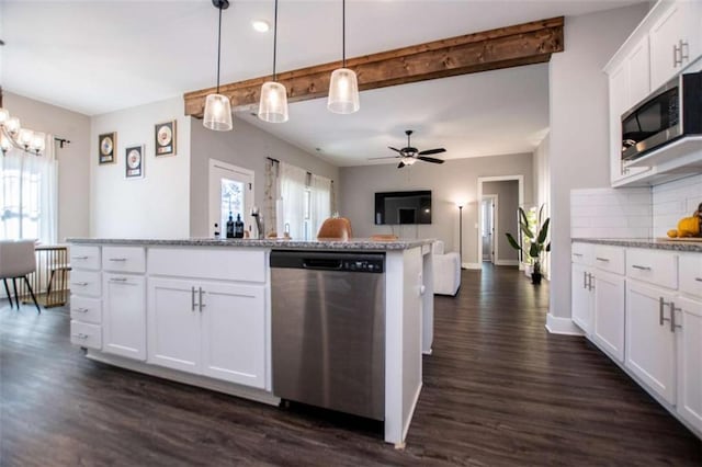 kitchen with backsplash, decorative light fixtures, white cabinetry, and stainless steel appliances