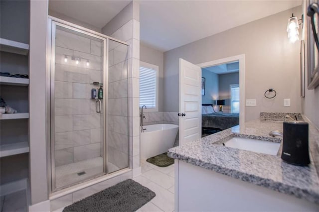 bathroom with tile patterned floors, vanity, and independent shower and bath