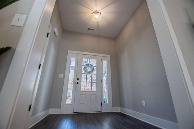 entrance foyer with dark hardwood / wood-style flooring