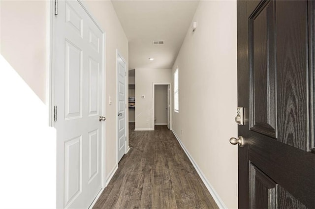 hallway featuring dark wood-type flooring