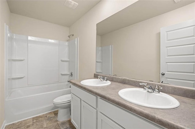 full bathroom featuring shower / bathtub combination, vanity, and toilet