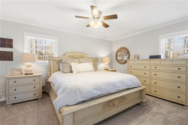 bedroom featuring ceiling fan, light colored carpet, crown molding, and multiple windows