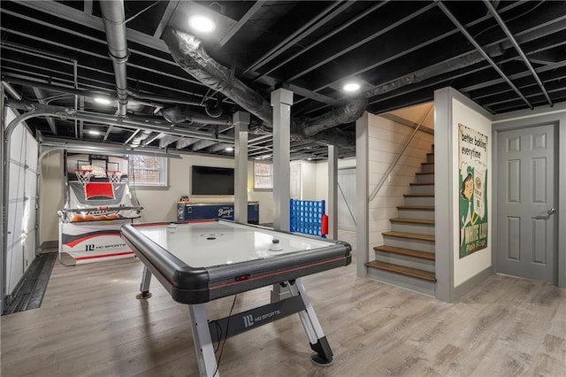 game room with hardwood / wood-style floors