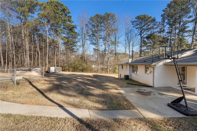 view of yard featuring a patio and central air condition unit