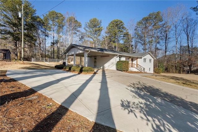 exterior space featuring a carport