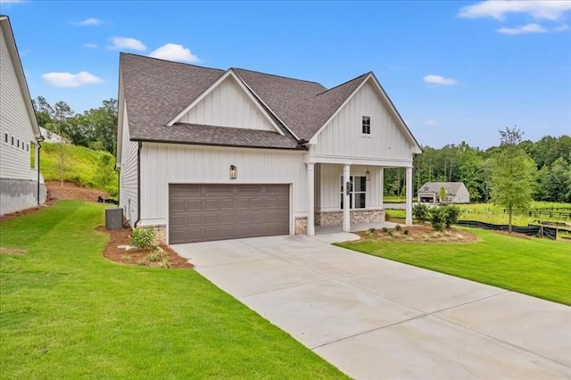 modern farmhouse featuring central AC unit, a garage, a shingled roof, driveway, and a front yard