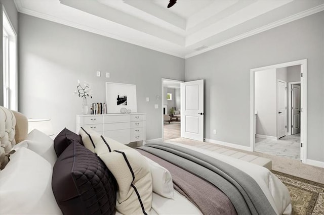 bedroom with crown molding, a raised ceiling, a high ceiling, carpet flooring, and baseboards