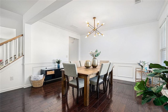 dining space with a notable chandelier, crown molding, and dark wood-type flooring