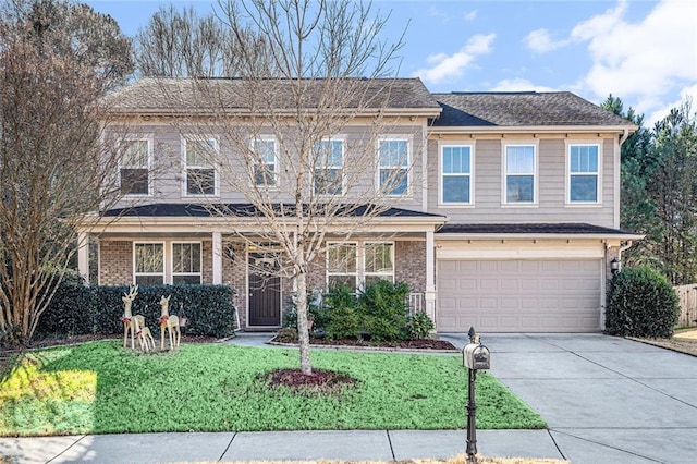 view of front of house with a garage and a front yard